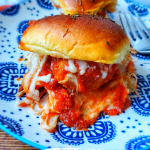 These Super Easy Baked Meatball Sliders are made with store bought meatballs, sauce, cheese and tasty Hawaiian rolls!
