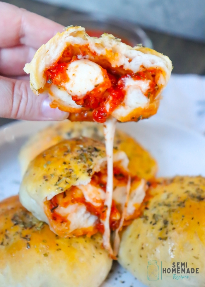 PIZZA STUFFED BISCUIT broken apart with cheese pull