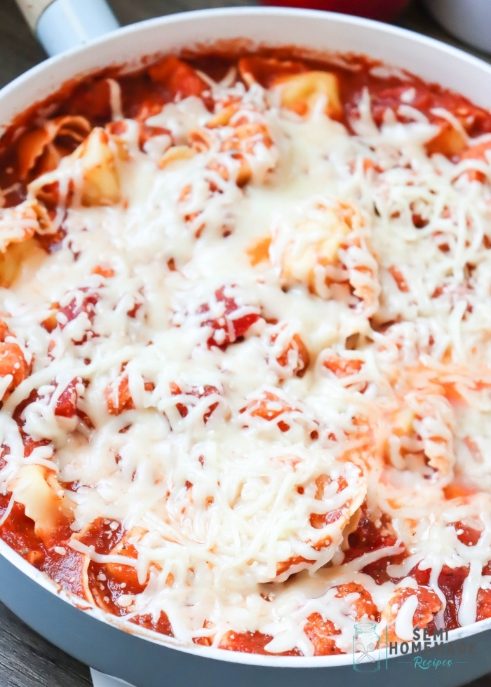 Semi Homemade Chicken Parmesan Tortellini is a super easy meal that's ready in about 30-45 minutes! Breaded Chicken nuggets, pasta sauce and cheese tortellini is absolutely delicious! This can also be made with cheesy tortelloni!