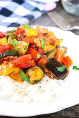 Easy Skillet Ratatouille over rice on a white plate