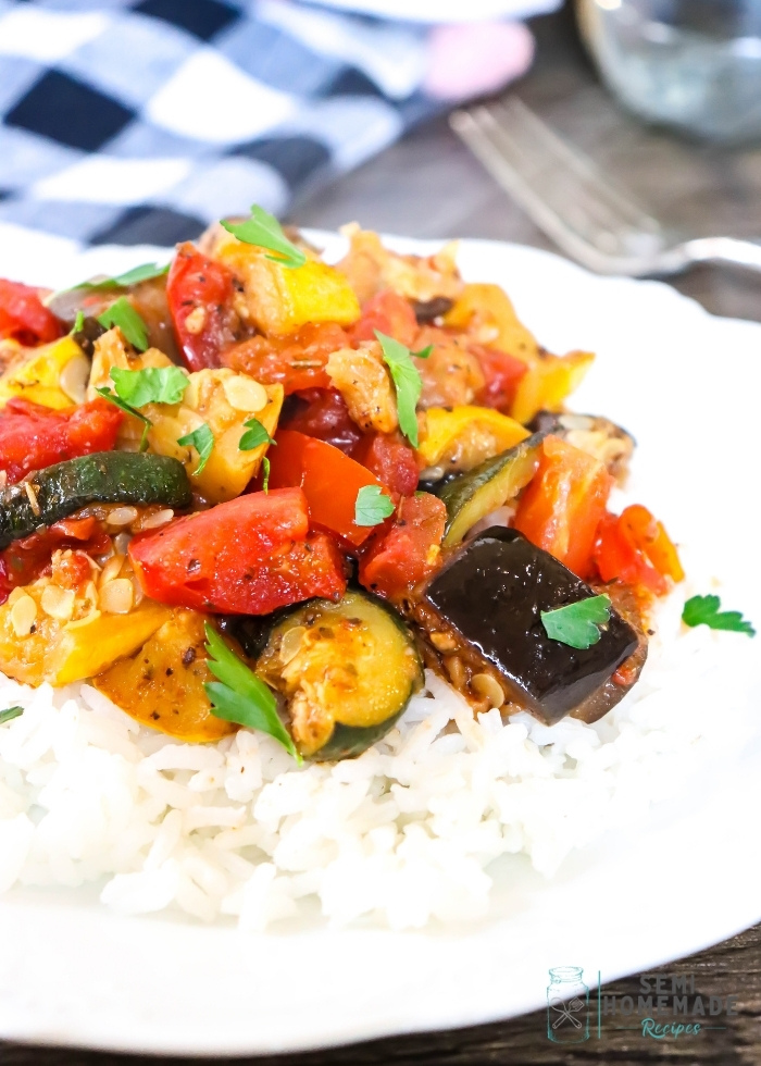 Easy Skillet Ratatouille over rice on a white plate