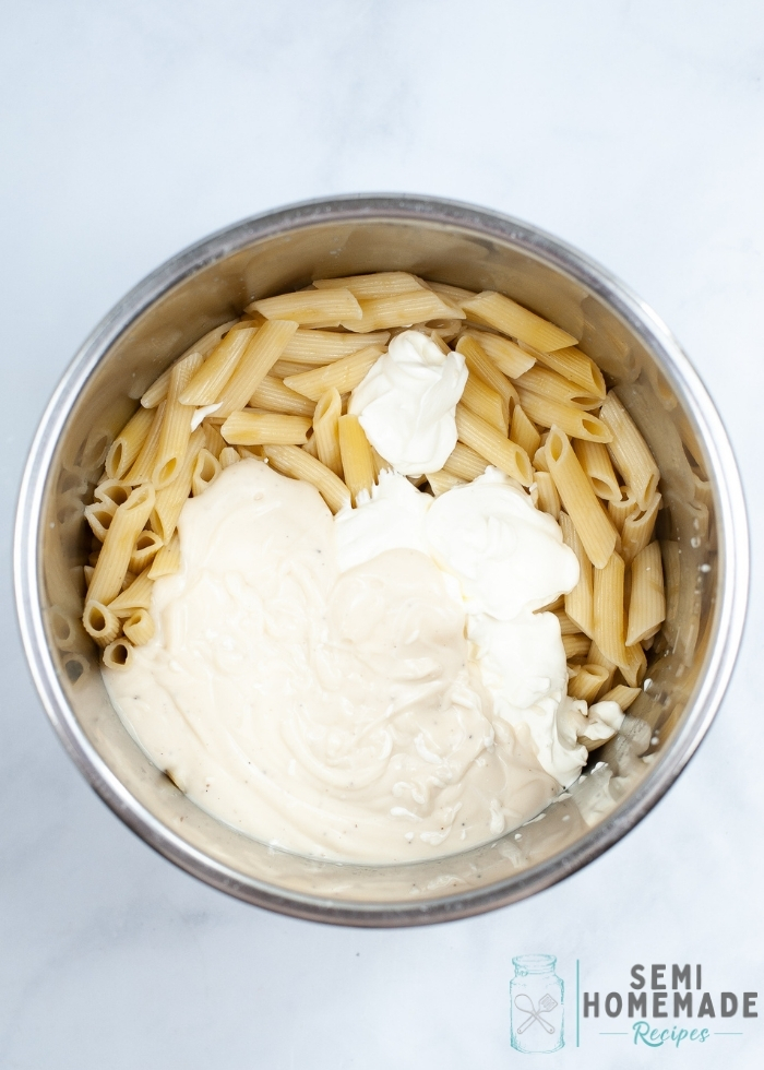 Adding sauce to pasta in bowl