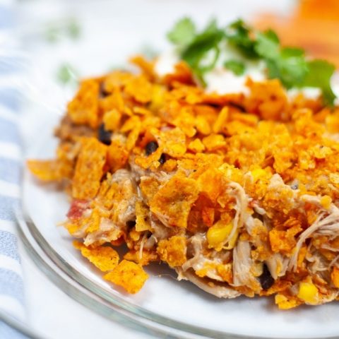 This super easy Dorito Casserole is made form layers of Nacho Cheese Doritos chips, beans, corn, chicken and a few other ingredients for a great weeknight meal!