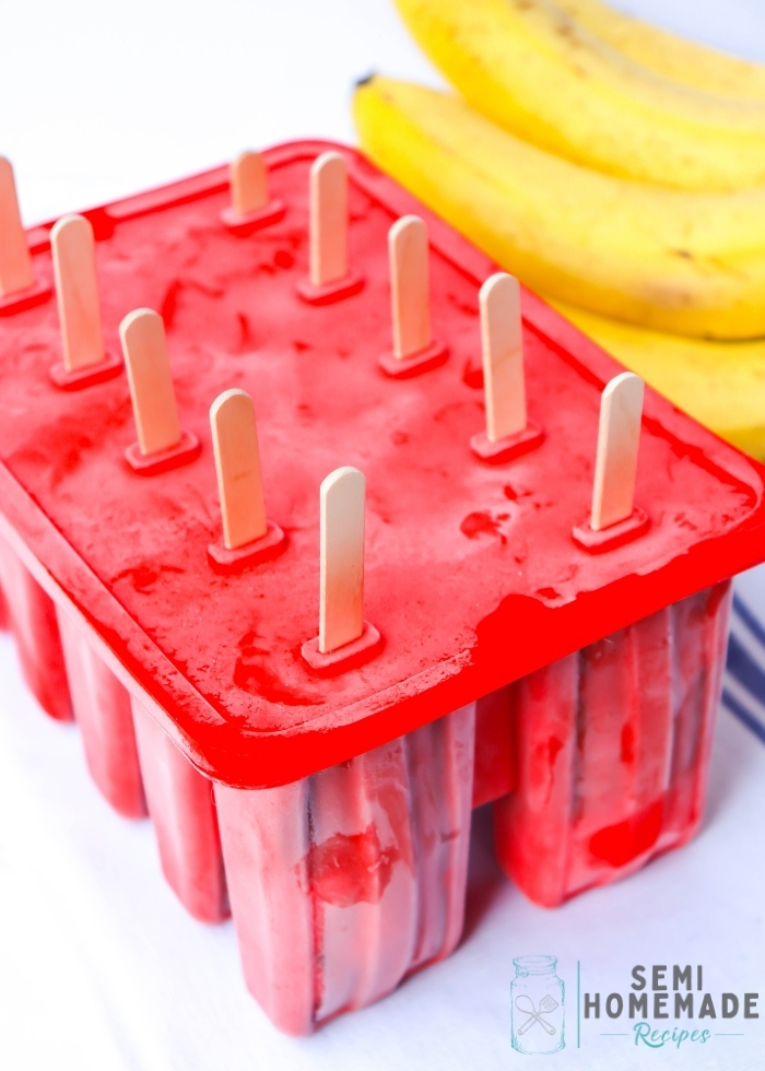 frozen pudding pops in a red mold