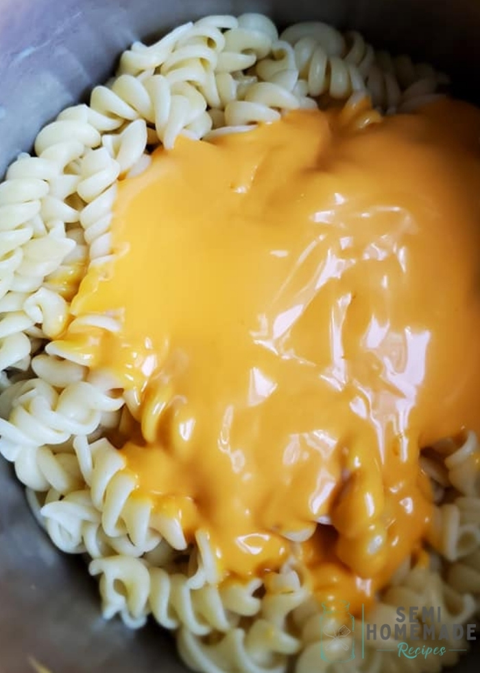 cooked Rotini pasta with cheese sauce