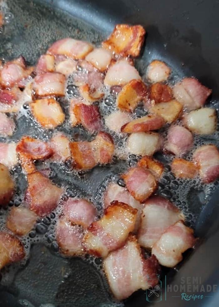 cooking bacon in bowl of black slow cooker