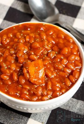 slow cooker baked beans with parsley in white bowl