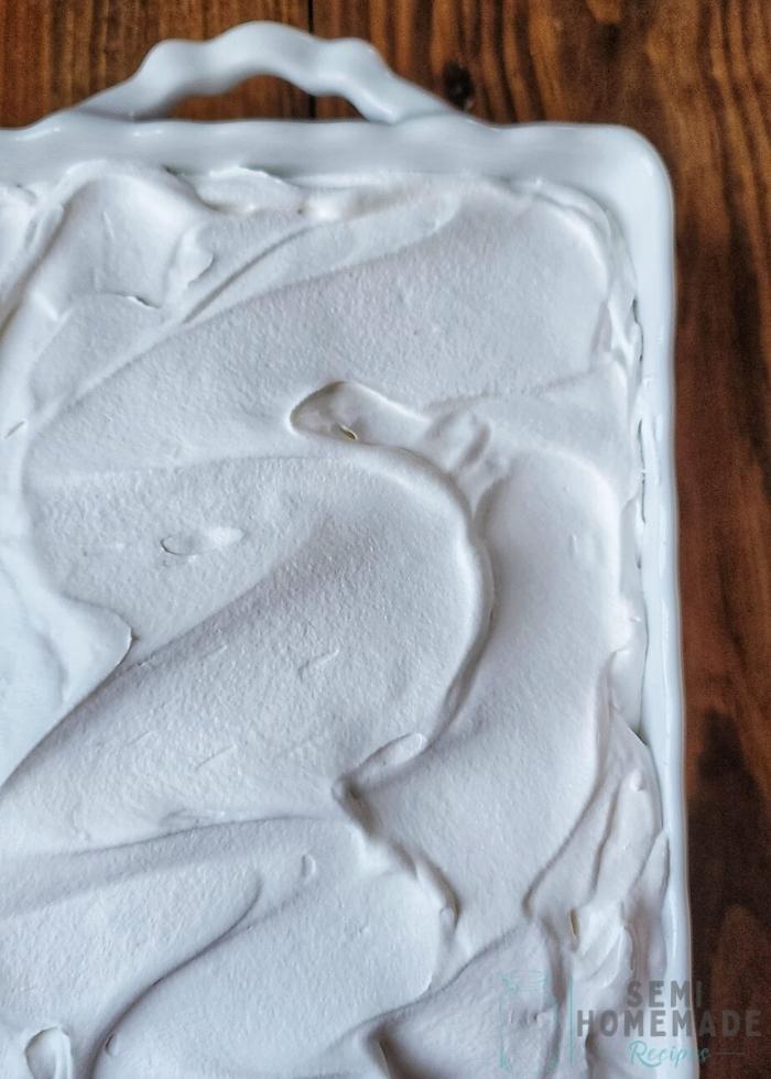CARROT CAKE POKE CAKE with whipped cream
