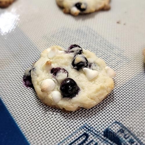 Blueberry Vanilla Cake Mix Cookie baked on cookie sheet