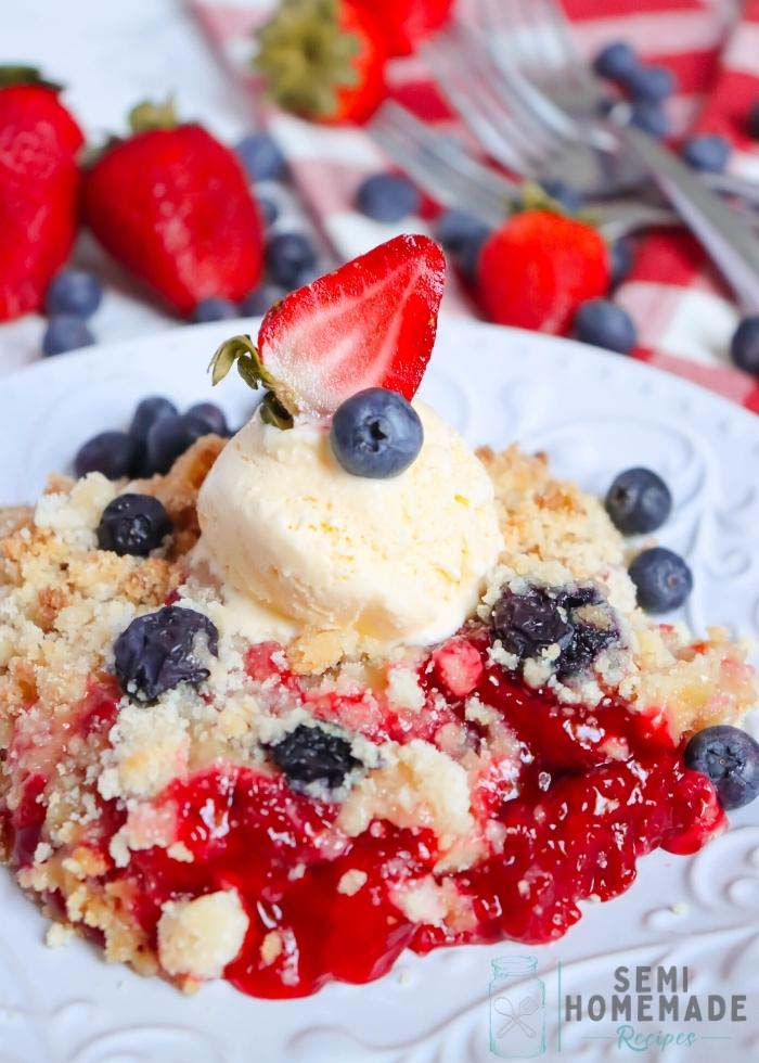 Patriotic Cobbler on white plate - Strawberry and Blueberry Crisp