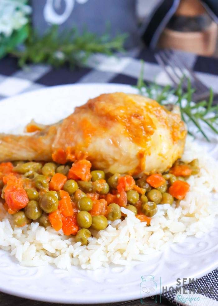 baked Chicken Peas and Carrots and fresh Rosemary on a bed of wh