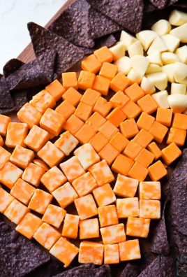 Need an easy snack tray for a Halloween Party? This Cheese Tray takes minutes to put together and taste WAY better than real candy corn!