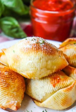 Air Fryer Pizza Pasta Pockets - Crispy Shells stuffed with ground beef or ground turkey, pizza sauce and fresh mozzarella peals! Top these Pizza pockets with parmesan cheese and parsley before dunking them into pizza sauce for a great appetizer, dinner or snack!