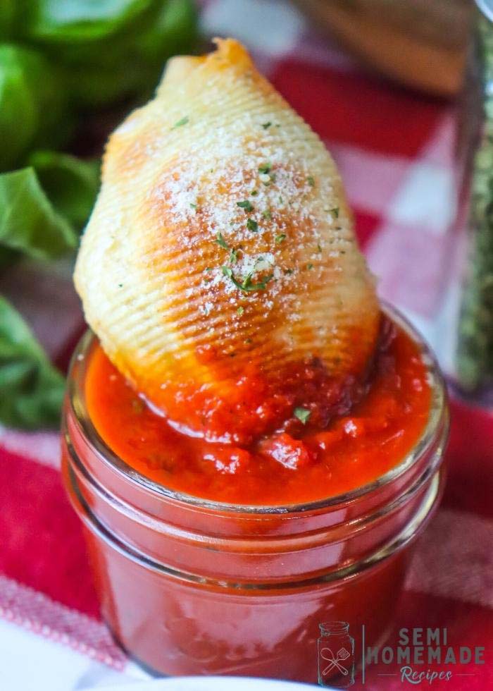 Dipping a Air Fryer Pizza Pasta Pockets in pizza sauce