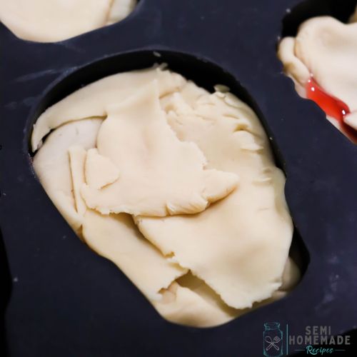Pie dough over Chery Pie Filling in Pie dough inside of Skull Cherry Pies Mold