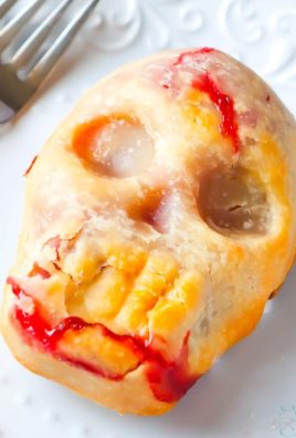 Skull Cherry Pies - the perfect, gory but sweet Halloween dessert that is perfect for ending a Halloween themed dinner! Made with pie crust and canned cherry pie filling, this dessert couldn't be easier!