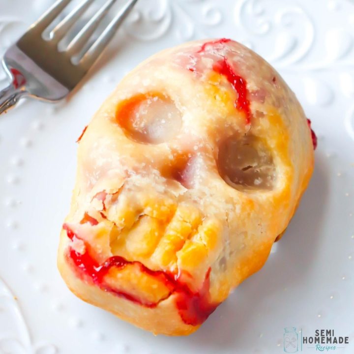 Skull Cherry Pies - the perfect, gory but sweet Halloween dessert that is perfect for ending a Halloween themed dinner! Made with pie crust and canned cherry pie filling, this dessert couldn't be easier!