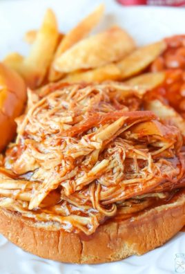 This Slow Cooker Dr. Pepper BBQ Chicken is so easy to make that you'll want to add it to your menu all the time! 3 ingredients and a few hours in the Crockpot is all that stands between you and a delicious meal! This Slow Cooker Dr. Pepper BBQ Chicken is perfect on its own but even better as a BBQ sandwich on a brioche bun!
