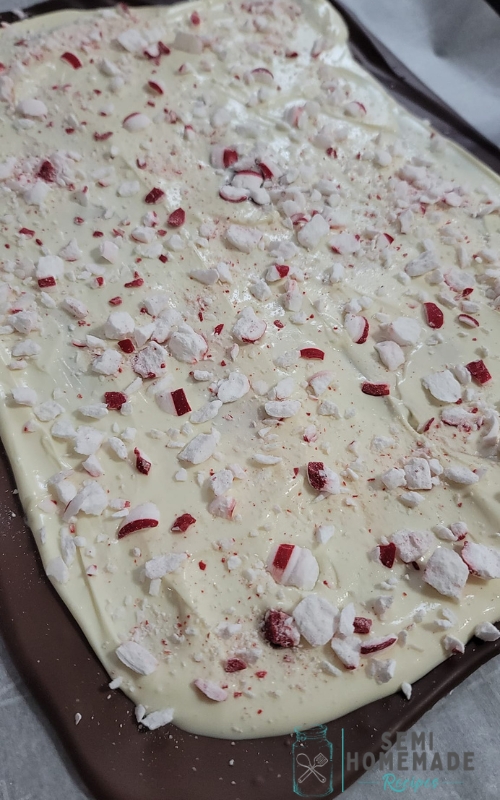 Melted white and chocolate almond bark with crushed peppermints