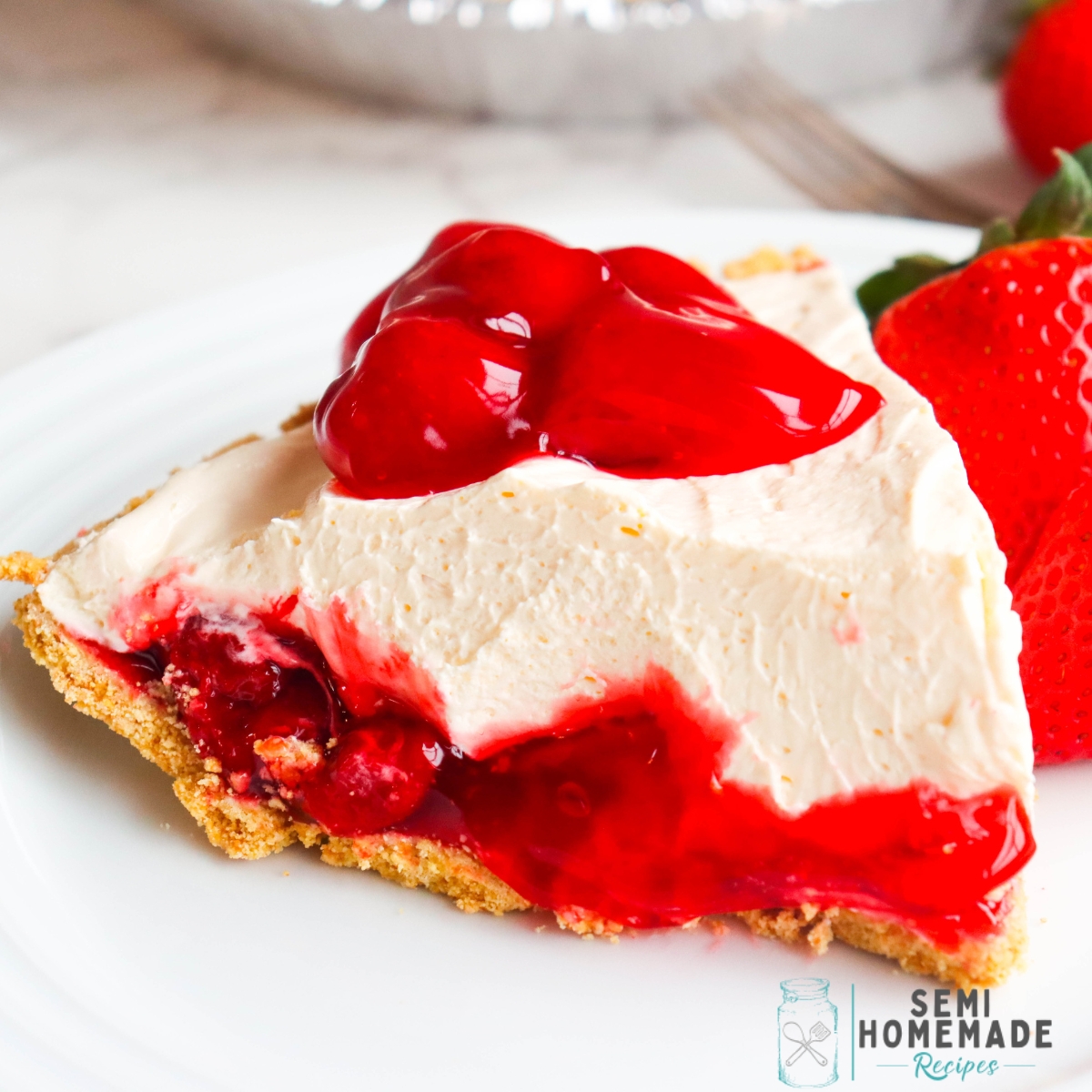No Bake Strawberry Cheesecake Pie - This tasty, no bake cheesecake is an easy dessert with the perfect layers of strawberry pie filling and creamy no bake cheesecake! Top it the slices with strawberry pie filling or whipped cream!