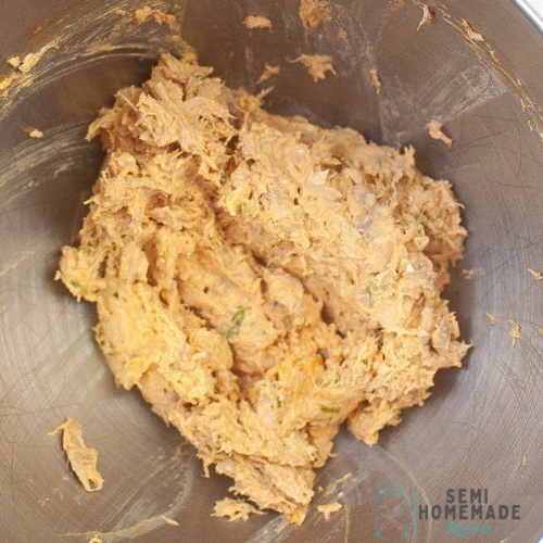 buffalo chicken mixture ingredients in a mixing bowl