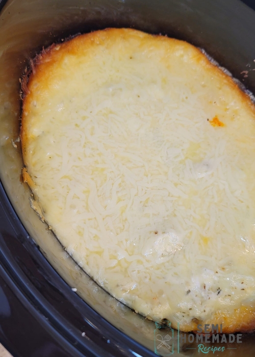 Melted cheese on slow cooker ziti