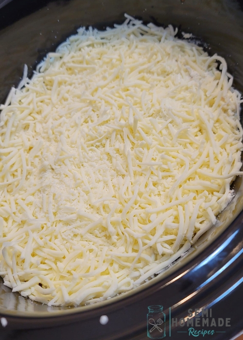 shredded cheese ontop of slow cooker ziti