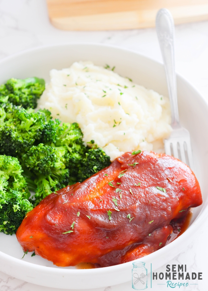 Slow Cooker Apple Butter BBQ Chicken with steamed broccoli and mashed potatoes in a white plate