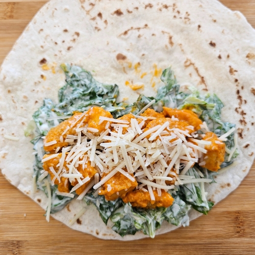 Tortilla with lettuce and Caesar dressing and buffalo chicken and cheese