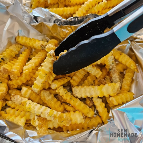 tossing frozen fries with evoo