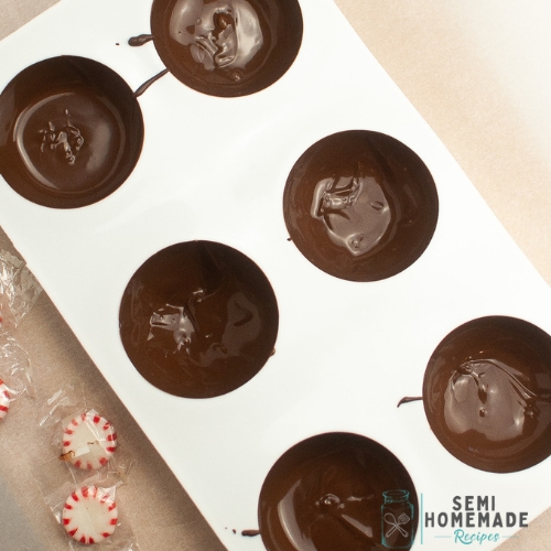 melted chocolate candy melts in a hot chocolate bomb mold