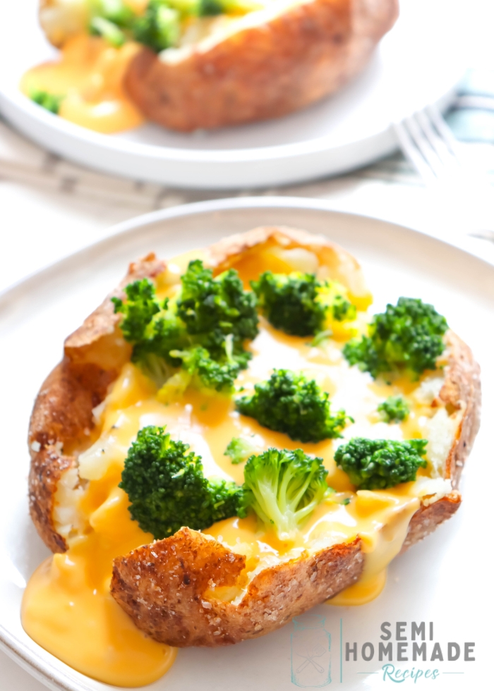 Broccoli and Cheese Stuffed Baked Potato on a white plate.