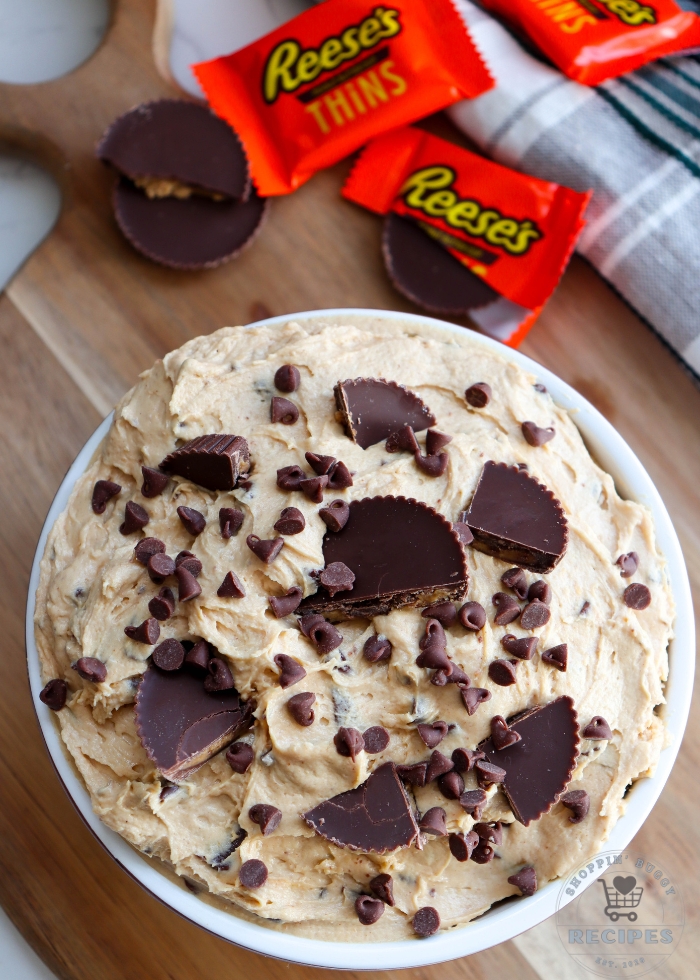 easy no bake Reese&rsquo;s peanut butter cup dessert dip in bowl with chopped Reese&rsquo;s cups