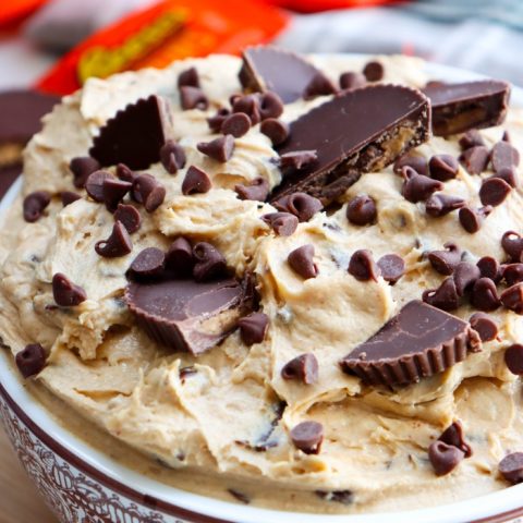 close up of creamy Reese’s peanut butter cup dessert dip with chocolate chips